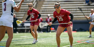 Female Saint Joseph's University lacrosse player on the field