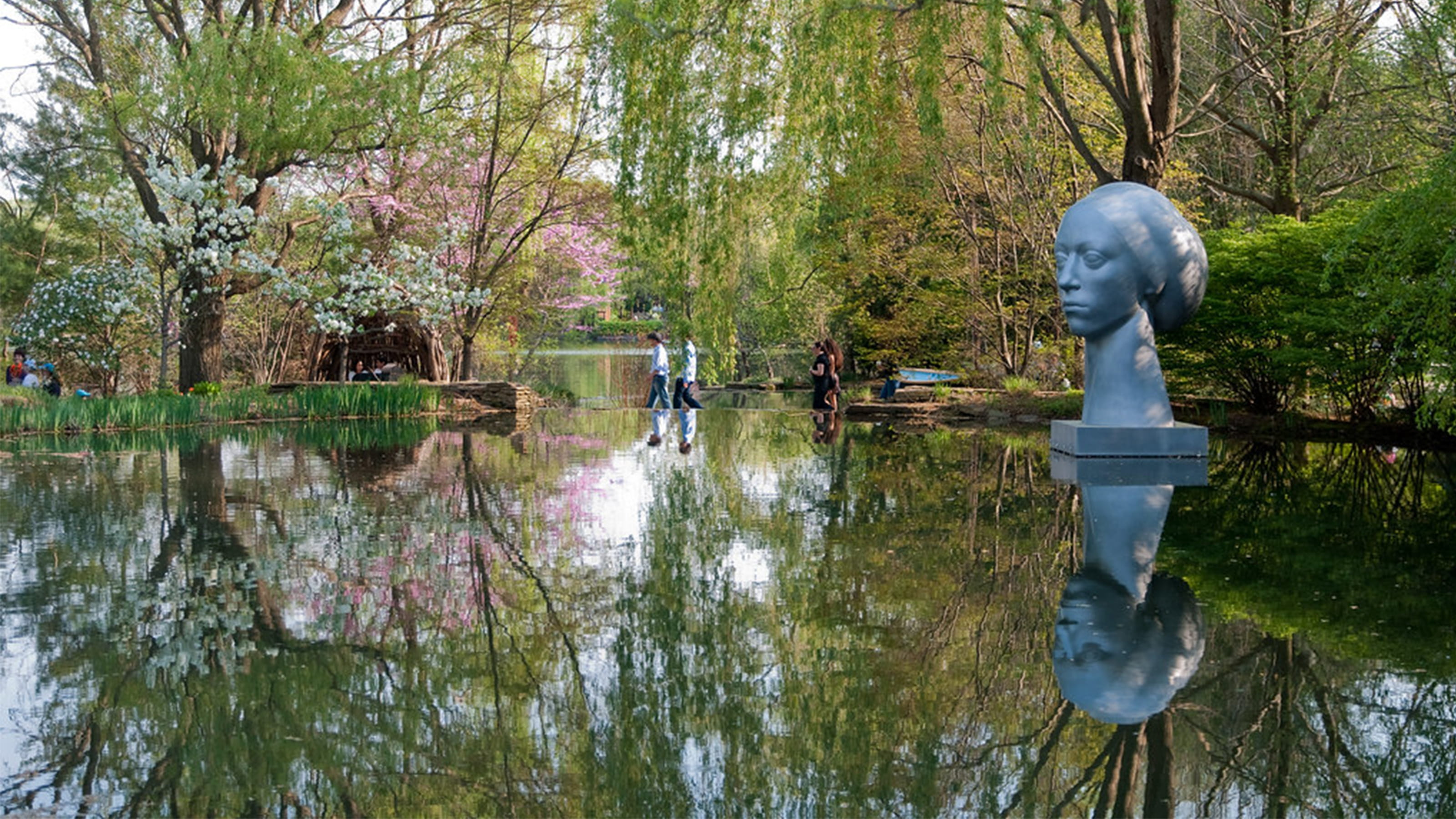 Bust of woman's head in water at Grounds for Sculpture