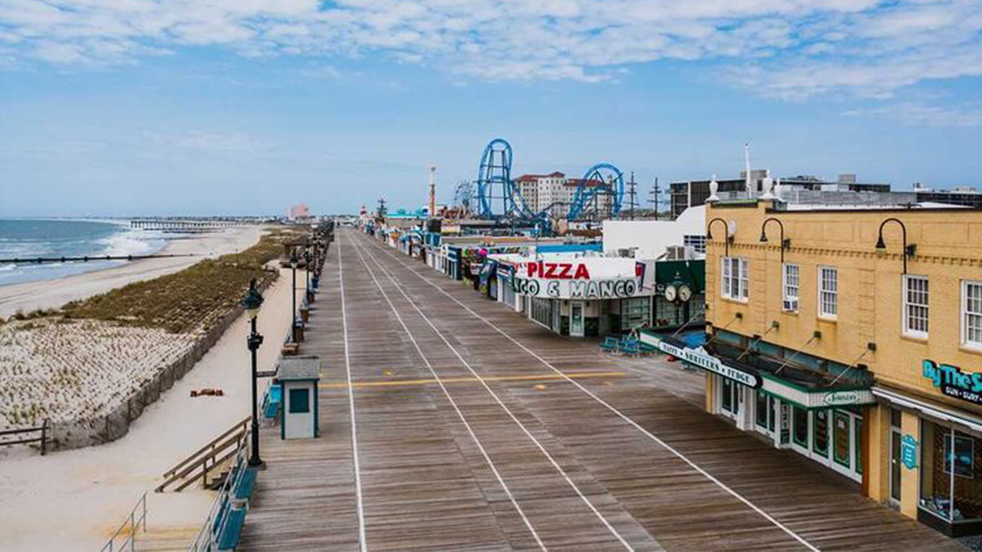 Aerial view of Ocean City, New Jersey, board walk with roller coaster in the distance.