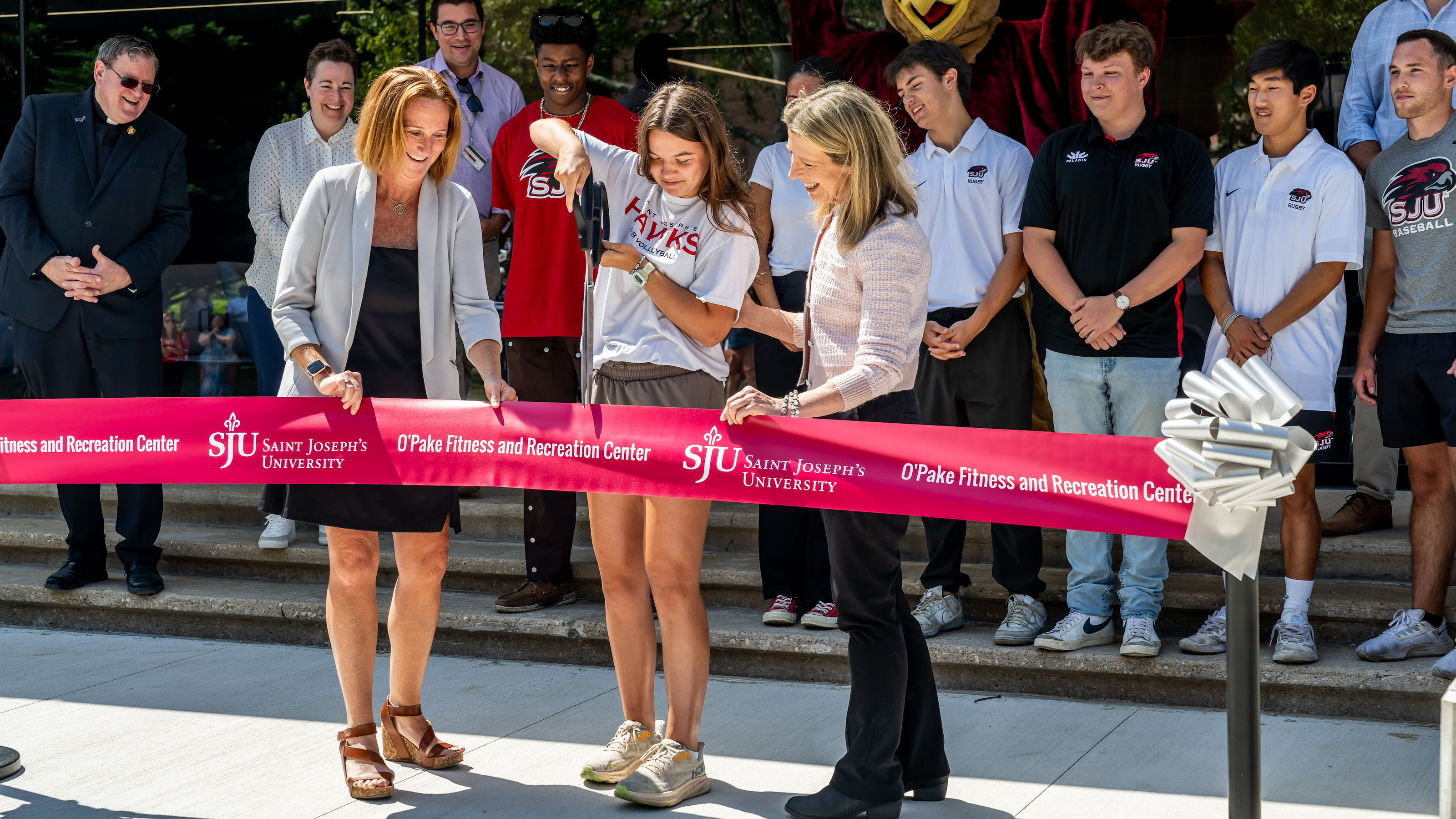 Lanie Smith, BS ’25, cutting a ribbon to officially welcome the campus community to the newly renovated O’Pake Fitness and Recreation Center.