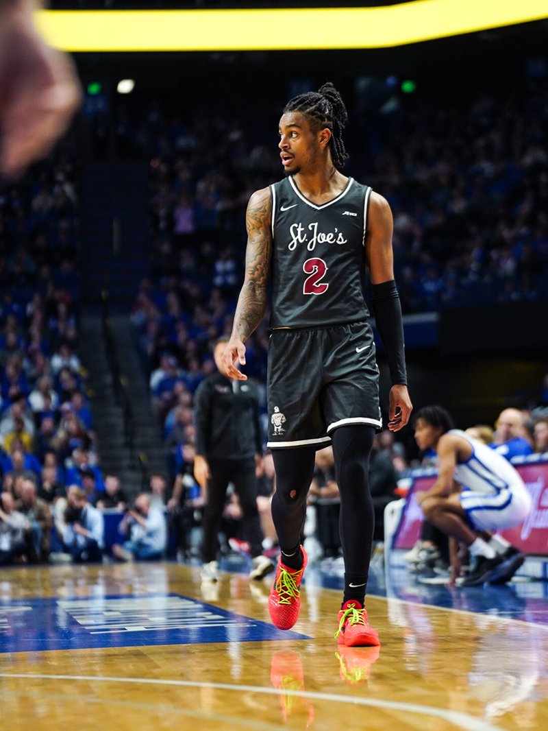 Saint Joseph's men's basketball player standing on court