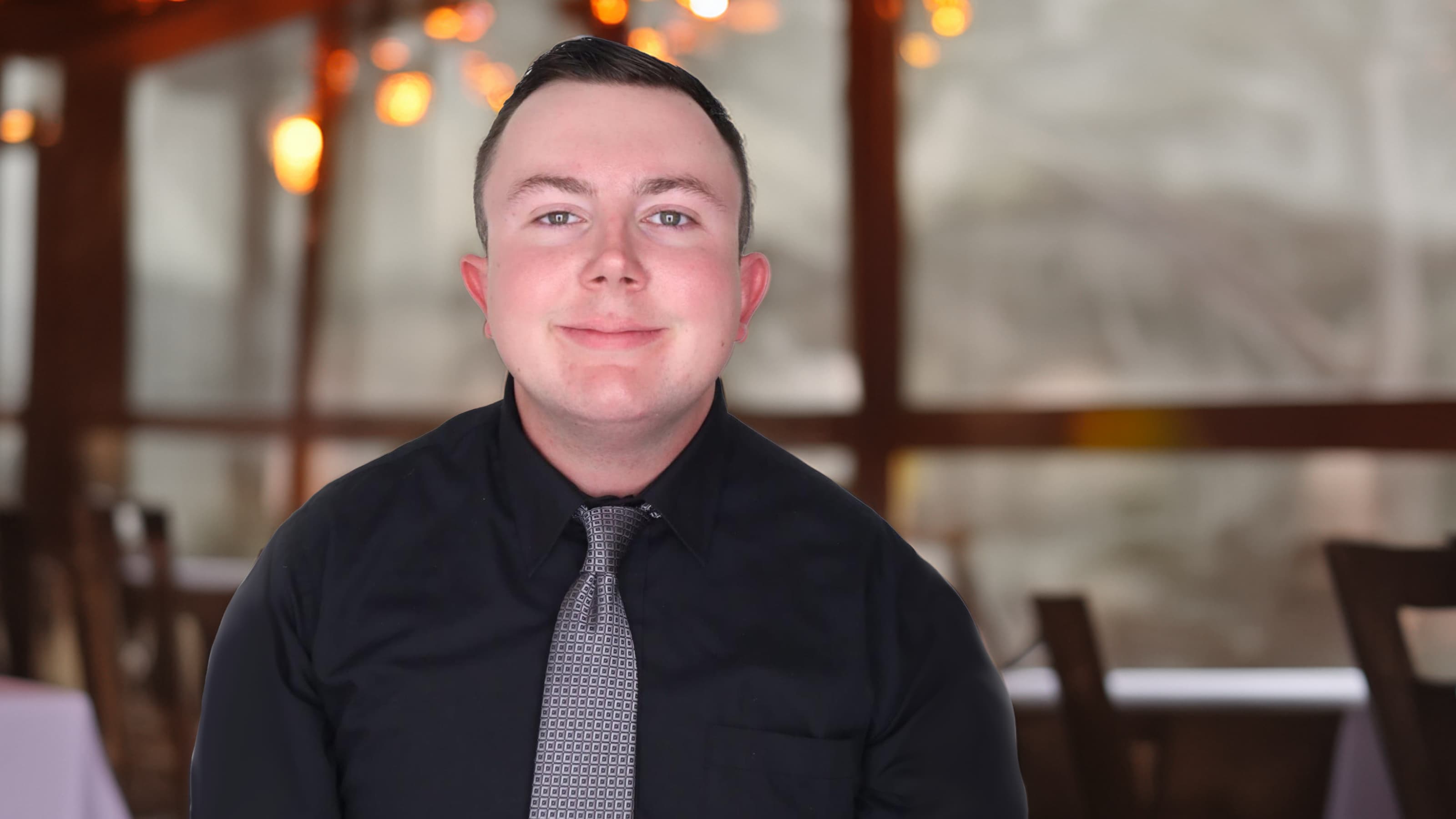 Headshot of Nate Murawski in a restaurant 