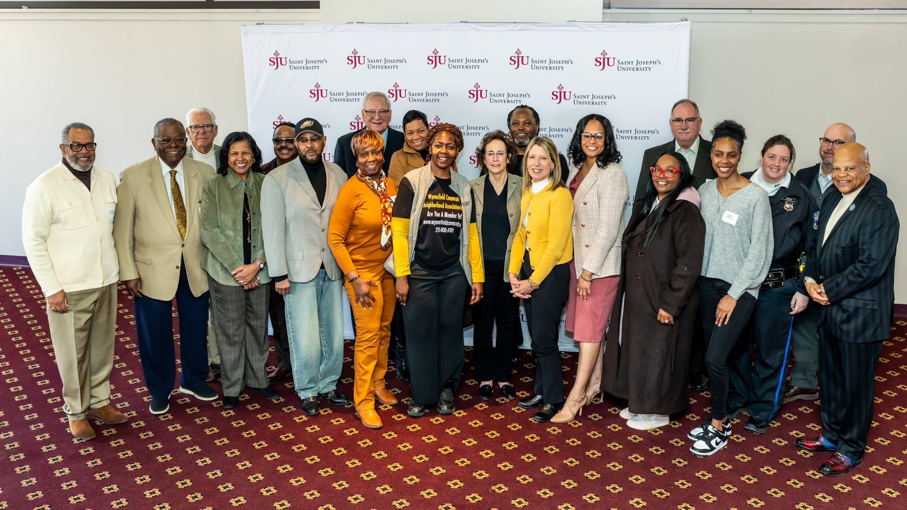 Group photo of Saint Joseph's University members with Wynnefield Overbrook representatives