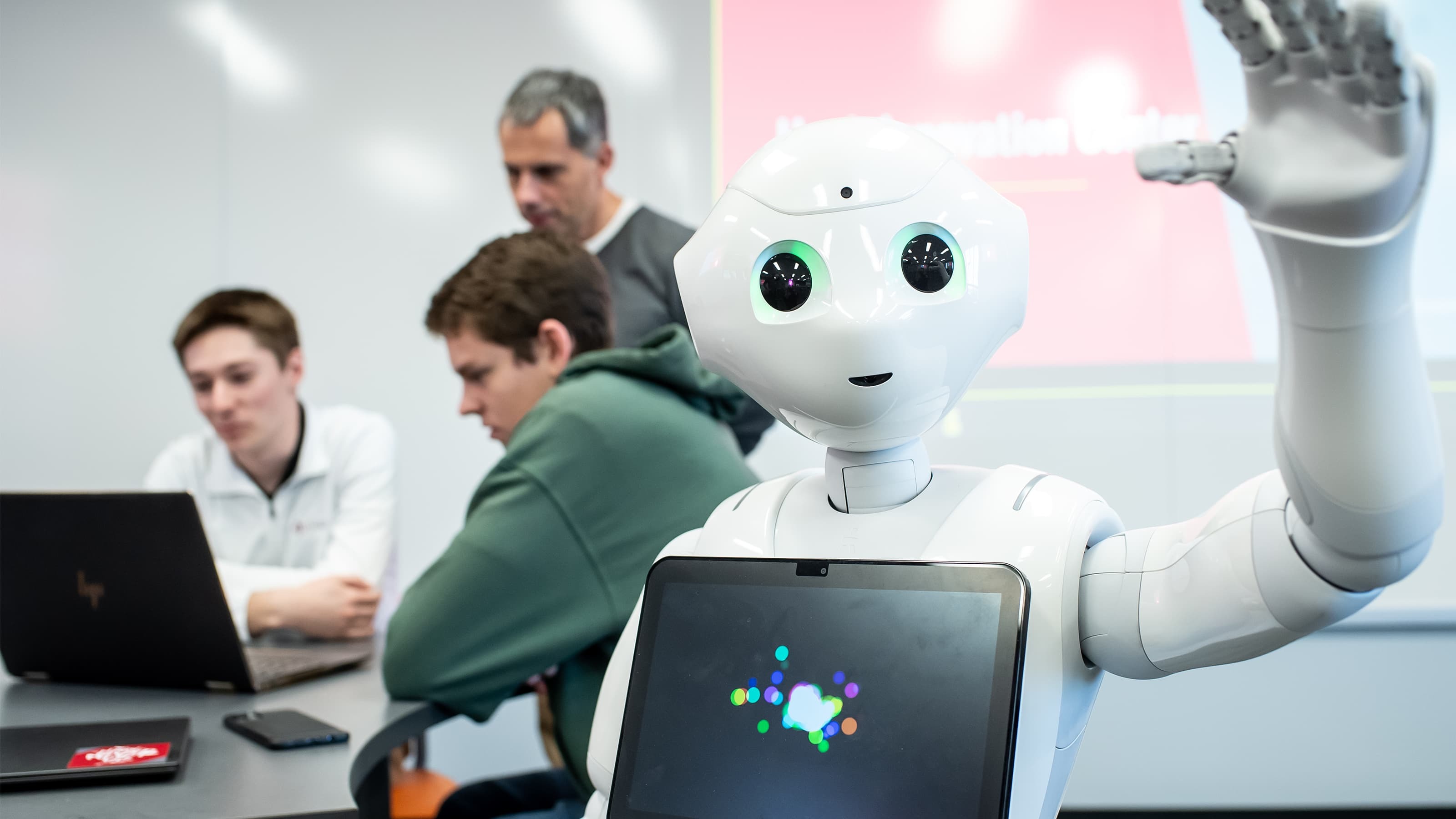 Iggy waves to the camera