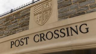 The SJU seal and "Post Crossing" above the newly opened Post Crossing underpass.