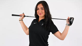 Saint Joseph's Golf player Elora Walker wearing black shirt holding golf stick