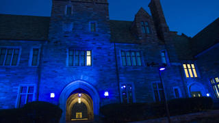 The lights of Barbelin Hall shining blue in honor of National Autism Awareness Month.
