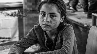A girl waits at the border.