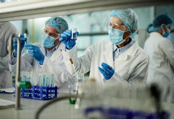 Chemists in a lab performing an experiment.