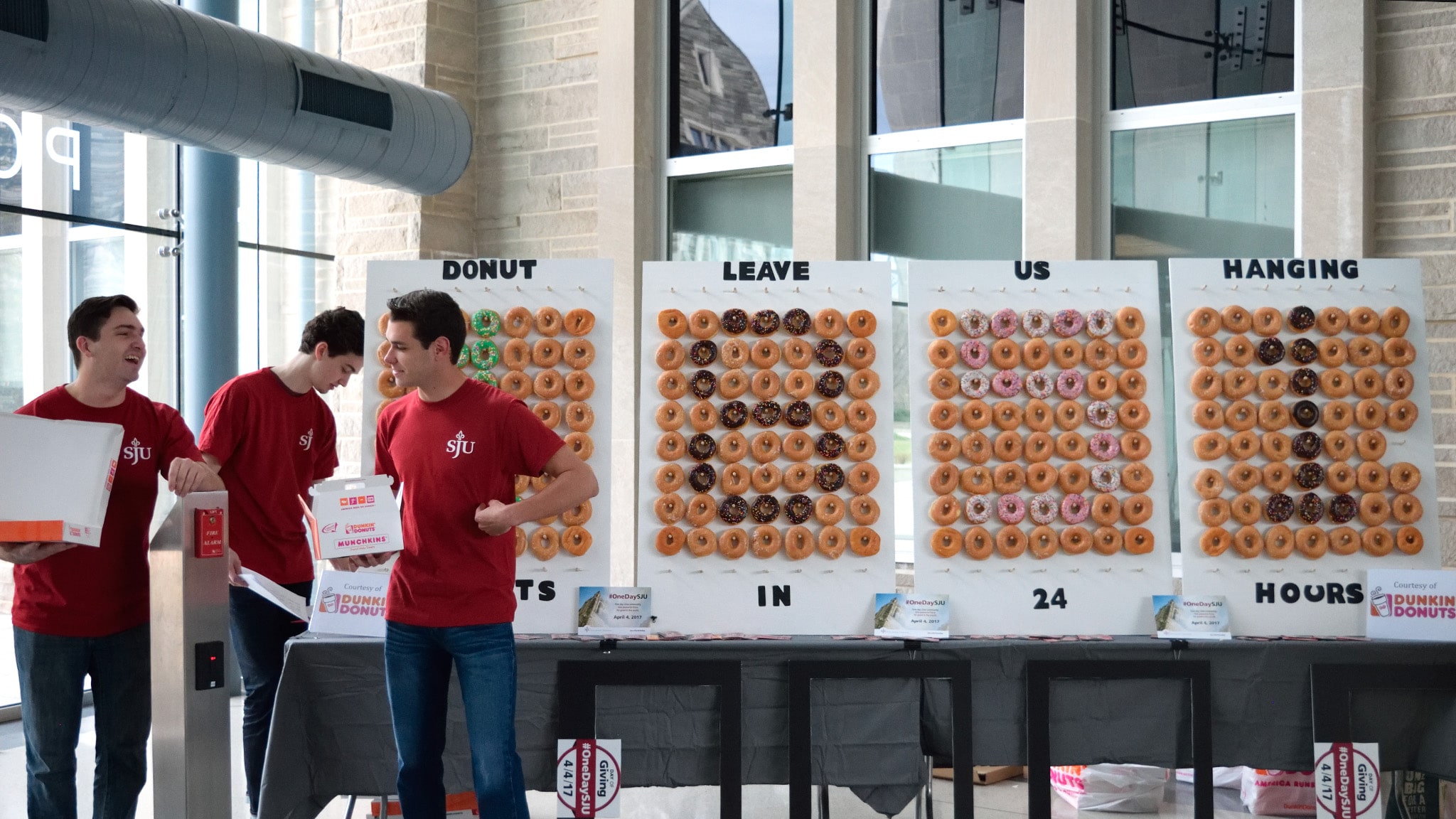 Day of Giving picture of a display made of doughnnuts asking people to donate