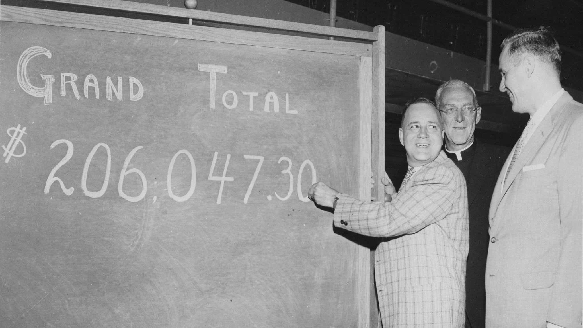 Day of Giving in 1959 on a chalk board with the total amount of $206047.30