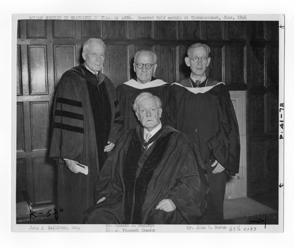 Four members of the Class of 1896 being honored at the 1946 Commencement ceremony in regalia.