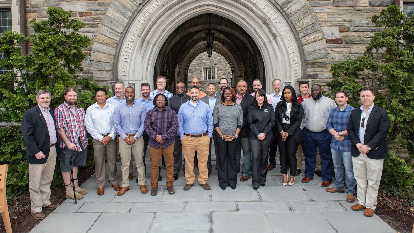 Members of an early cohort of the Entrepreneurship Bootcamp for Veterans in group photo on Hawk Hill