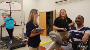 Students working with stroke patient