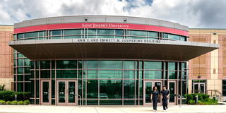 Saint Joseph's University in Lancaster Cooper building with students walking by