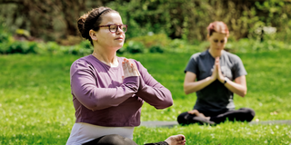 Students practice yoga